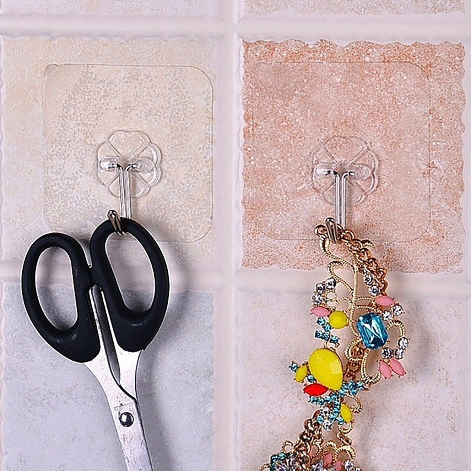 Small strong adhesive wall hooks in stainless steel for versatile use Small strong adhesive wall hooks in stainless steel for versatile use